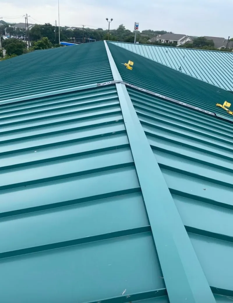Green commercial metal roof ridge and valley for Metal Roof Repair in Cameron