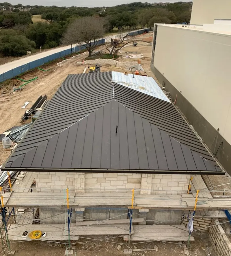 Metal roof new construction with scaffolding in Cameron